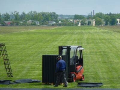 Laying TERRA-GRID E 35 ground grids on runway in Ostrow