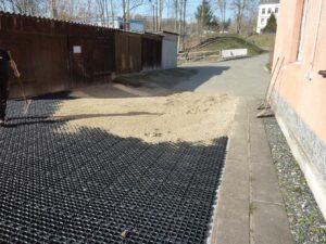 Backfilling ground reinforcement with sand or gravel