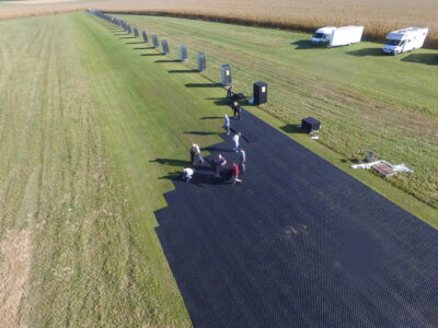 Laying of ground grids for runway reinforcement